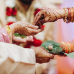 Ritual with coconut leaves during traditional Hindu wedding ceremony